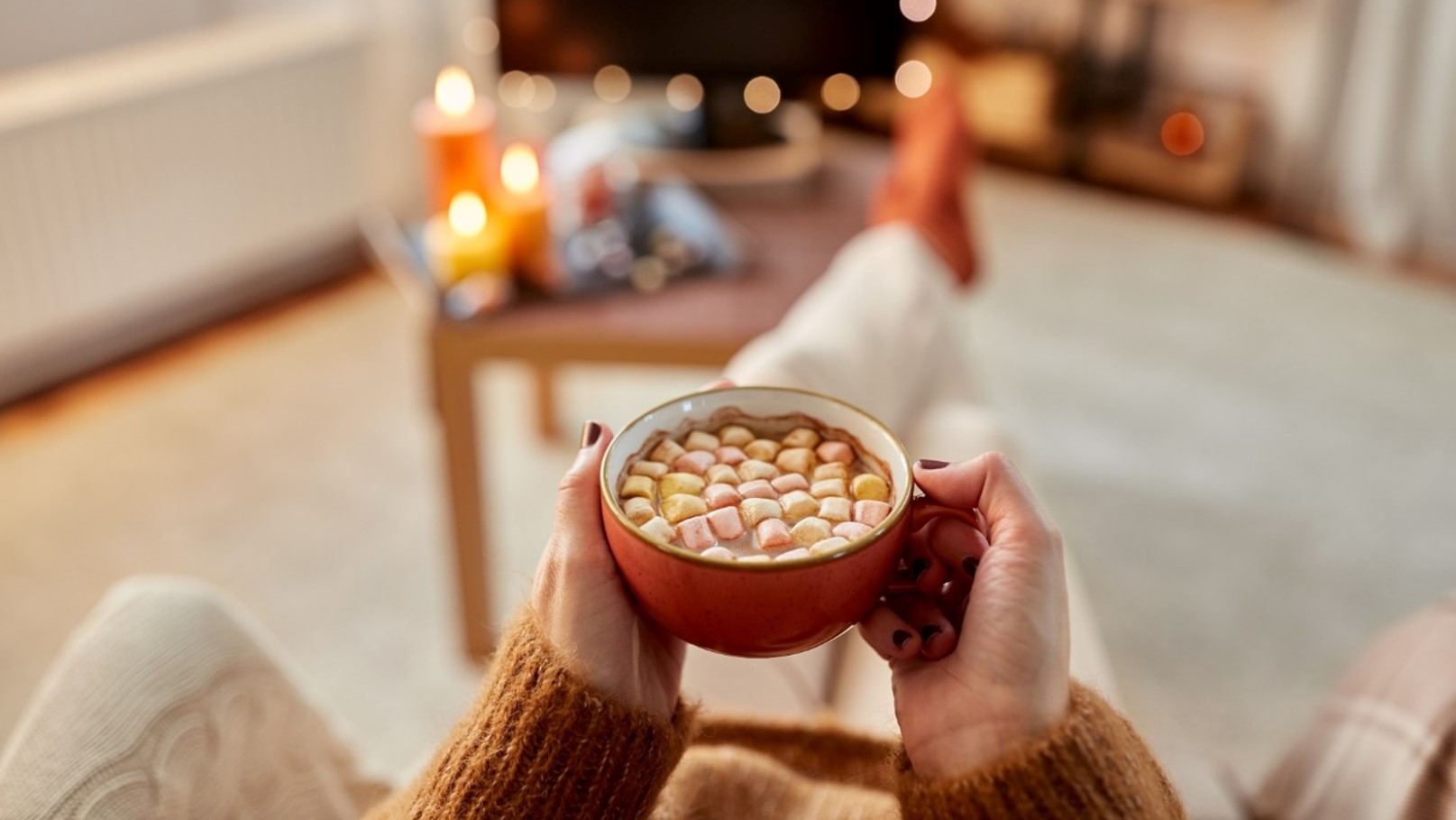 How to Run a Heat Pump Efficiently – Person Relaxing and Holding a Cup of Hot Chocolate