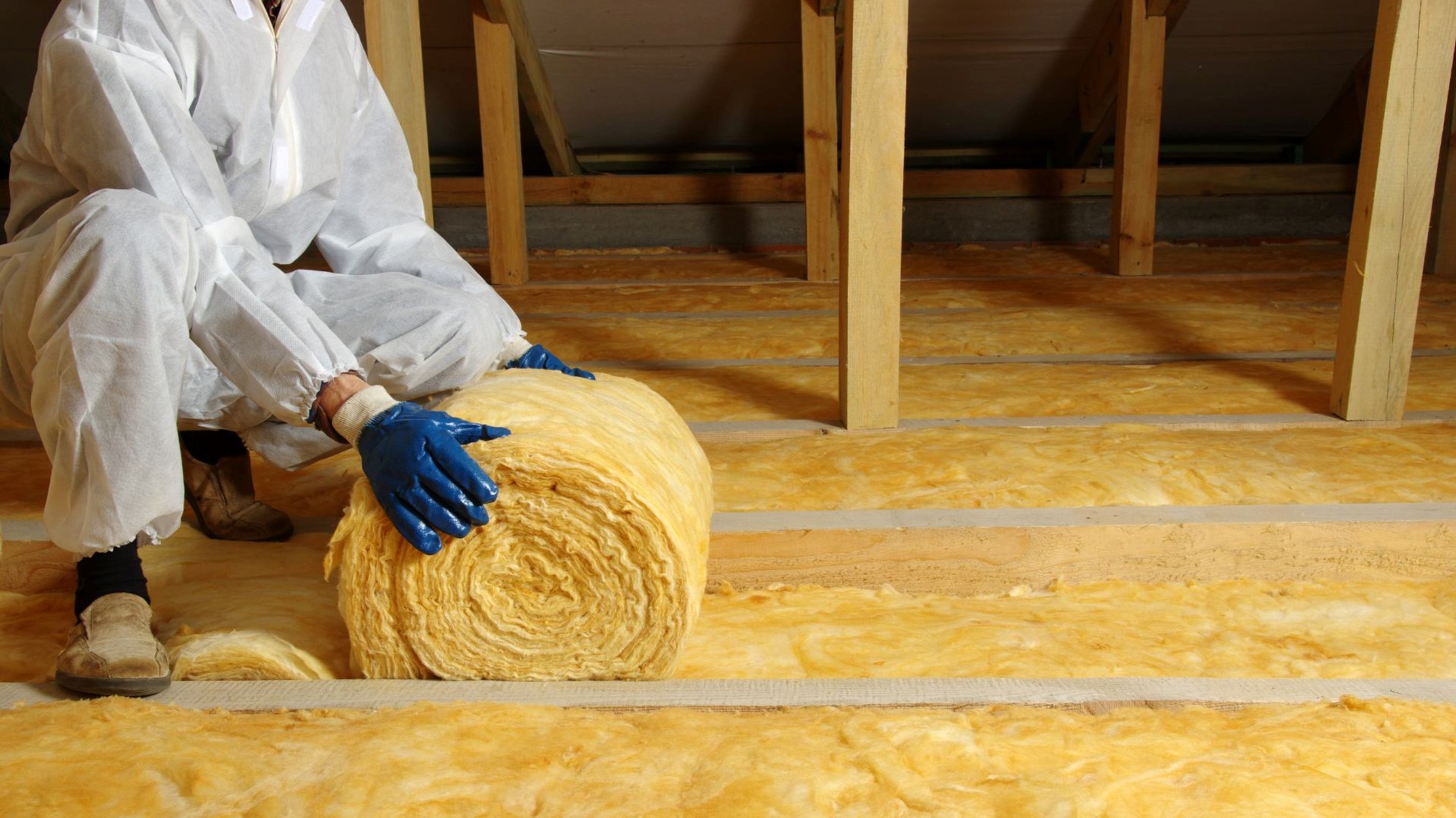 What Is the Best Type of Insulation for a House – Worker Installing Insulation